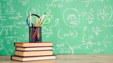 School books and pencils on desk, education concept