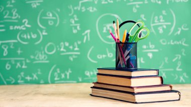 School books and pencils on desk, education concept