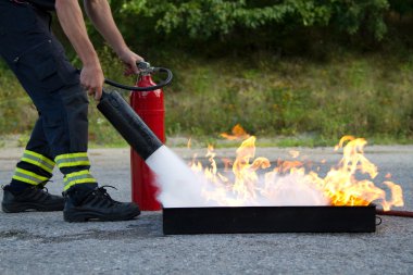Instructor showwing fire extinguisher clipart