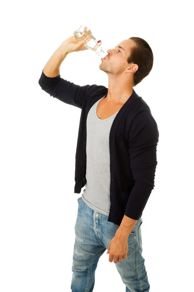 Man in profile drinking fresh water — Stok Foto