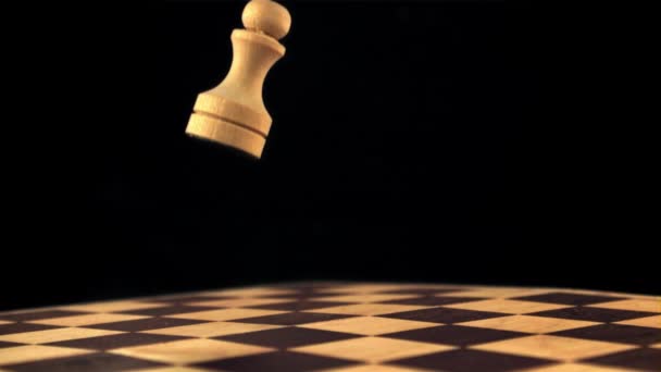 Super slow motion chess figure falls on the chessboard. Filmed on a high-speed camera at 1000 fps. — Stock Video