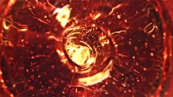Whirlpool of whiskey. Macro background. Filmed on a high-speed camera at 1000 fps. — Stock Video