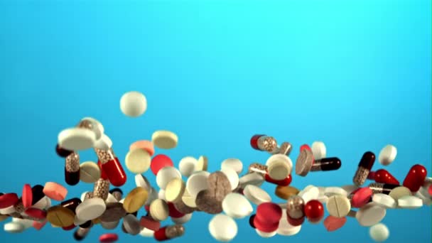 Different Types Pills Fly Fall Blue Screen Filmed High Speed — Stock Video