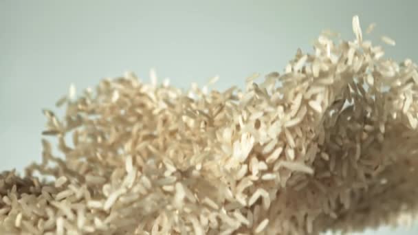 Rijst Stijgt Valt Naar Beneden Een Witte Achtergrond Textuur Van — Stockvideo