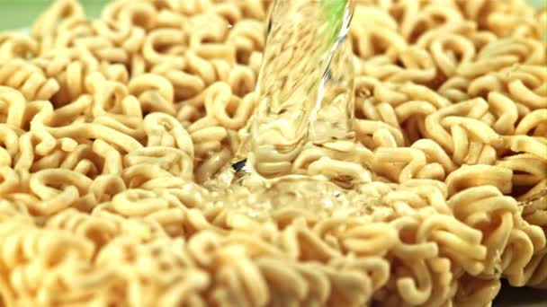 Water Splashes Pours Dry Noodles Macro Background Filmed Slow Motion — Stock Video