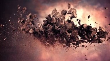 Çikolata parçaları yukarı aşağı hareket ediyor. Ateşli bir arka planda. Film yavaş çekimde 1000 fp..