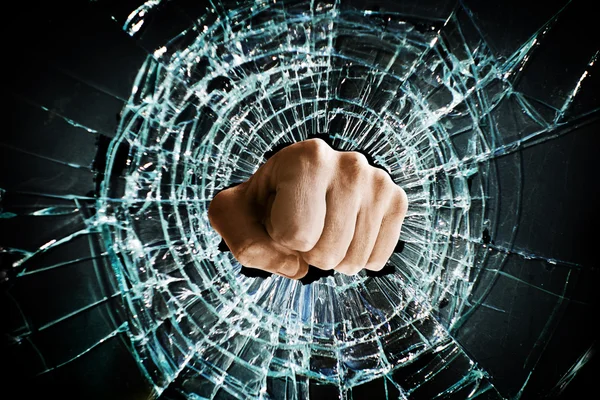 Broken window fist — Stock Photo, Image