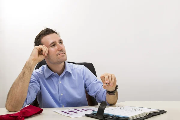 Thinking young entrepreneur at office — Stock Photo, Image