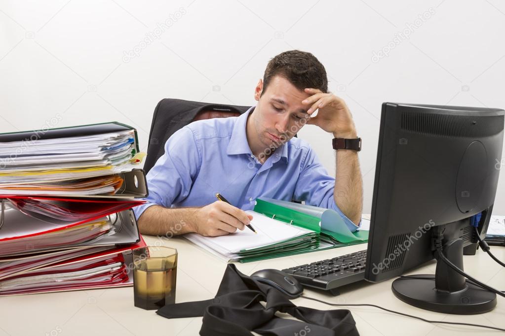 Stressed businessman at work