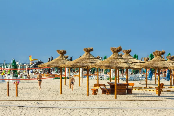 Reed umbrellas beach — Stock Photo, Image