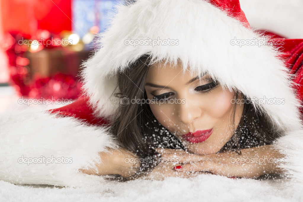 Santa Claus girl blowing snow