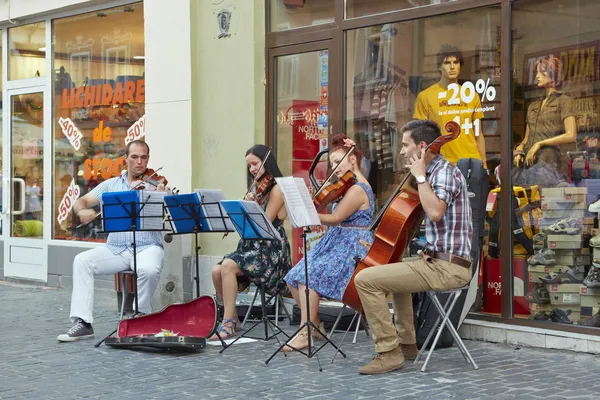 String quartet playing on the street — Stock Photo, Image