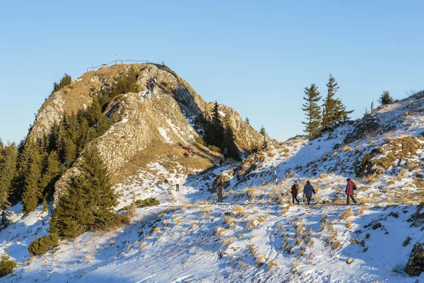 Tourists visiting Postavaru Peak, Romania — Stock Photo, Image