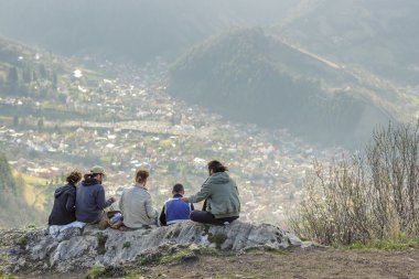 Hikers enjoying Brasov city panorama clipart