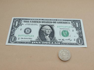 Bize doları banknot - ilk bize Başkan 1789-97 featuring bir dolarlık banknot, George Washington ön yüzünde ve bir Gbp Lirası para