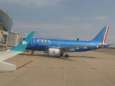TURIN, ITALY - CIRCA AUGUST 2022: ITA Airways Airbus A319 parked at the airport