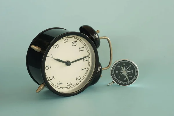 Alarm Clock Compass Blue Background — Stock Photo, Image