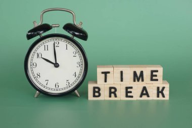 alarm clock with wooden cubes. Motivational concept