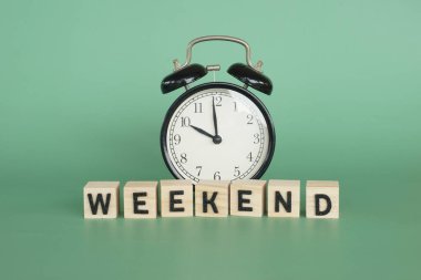 alarm clock with word Weekend