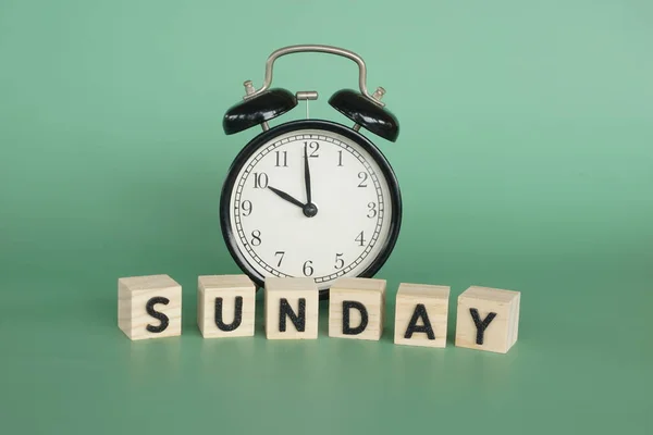 Alarm Clock Wooden Cubes Sunday Concept — стоковое фото