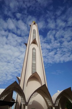 Melaka, Malaysia-August 6, 2022; tower of Melaka Straits Mosque against cloudy sky, located at Melaka city, Malaysia