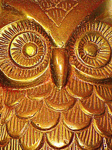 Owl in goud Stockafbeelding