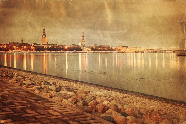Retro style image of night Riga cityscape — Stock Photo, Image