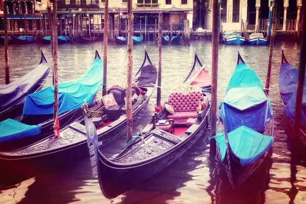 Retro style image of Venice seafront with gondolas on the waves — Stock Photo, Image