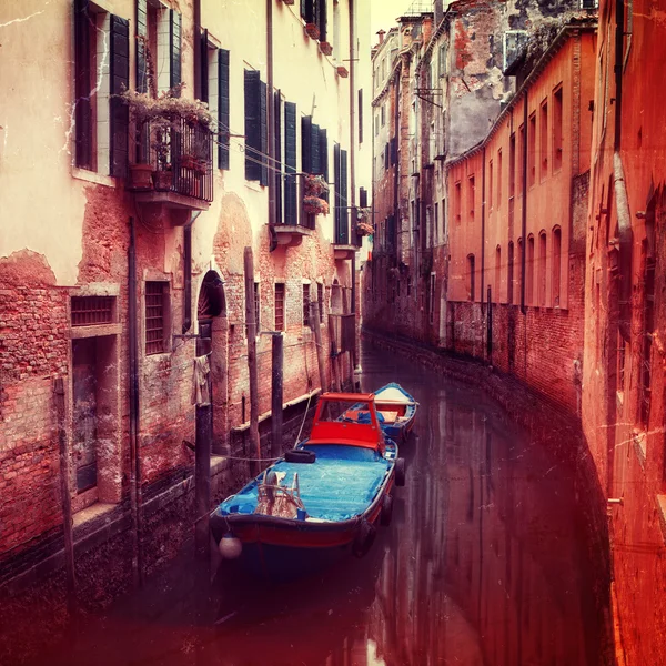 Retro style image of small canal in Venice — Stok fotoğraf