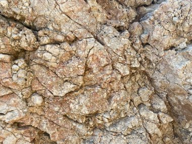 Taşların dokusu ve sarı arkaplan. Kaya dokusu.