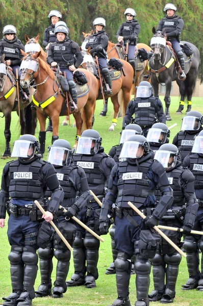 Modern day gladiators - police officers in riot gear respond to the civil disturbance — Stock Photo, Image