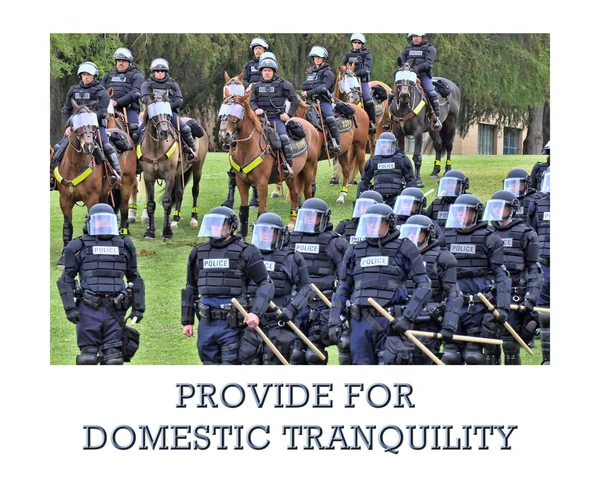 Police officers in protective gear on horseback — Stock Photo, Image