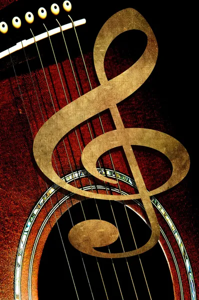 Treble clef op de achtergrond van de gitaar — Stockfoto