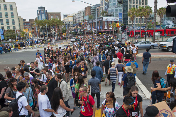 SAN DIEGO, CALIFORNIA - JULY 13: Crowds of participants cross the street in the gaslamp district while at Comicon in the Convention Center on July 13, 2012 in San Diego, California.