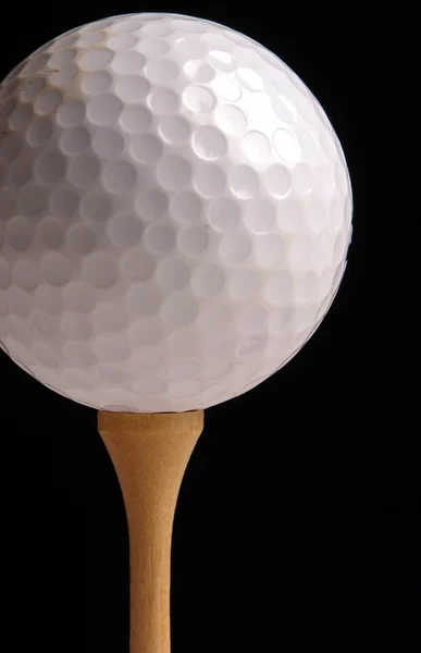 Pelota de golf en una camiseta — Foto de Stock