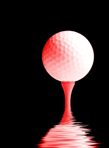 Pelota de golf en una camiseta — Foto de Stock