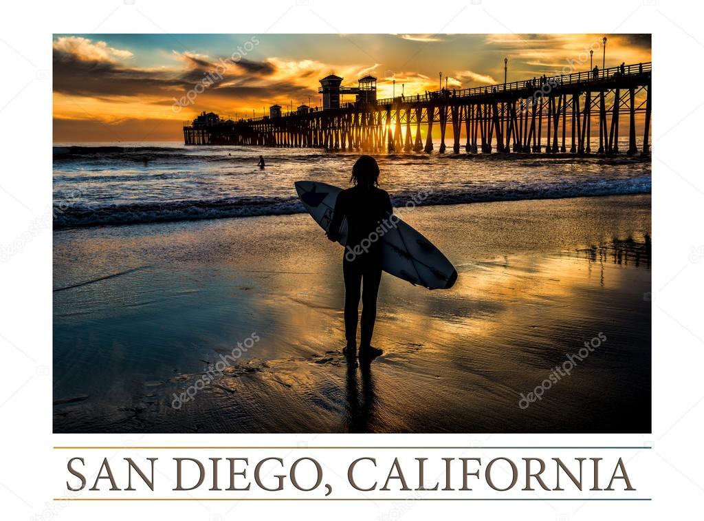 Silhouetted surfer at Oceanside Pier, Oceanside, California.