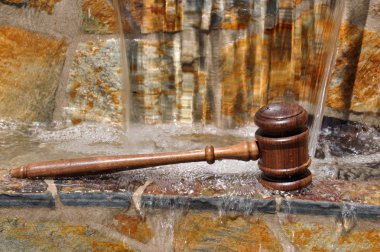 Wooden Gavel and flowing water clipart