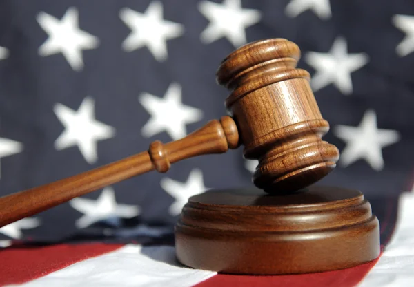 Gavel atop American flag — Stock Photo, Image