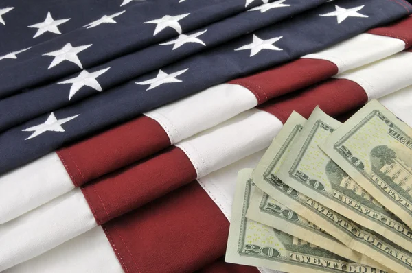 Valuta statunitense e bandiera americana — Foto Stock