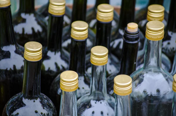 Row of empty big glass bottles — Stock Photo, Image
