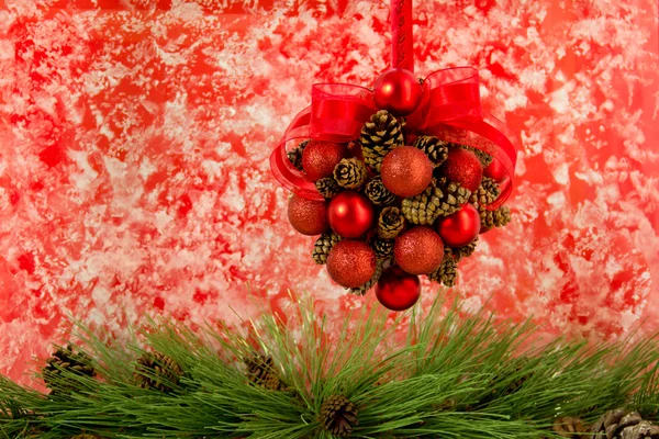 Pine Cone and Red Ball Hanging Decoration — стоковое фото