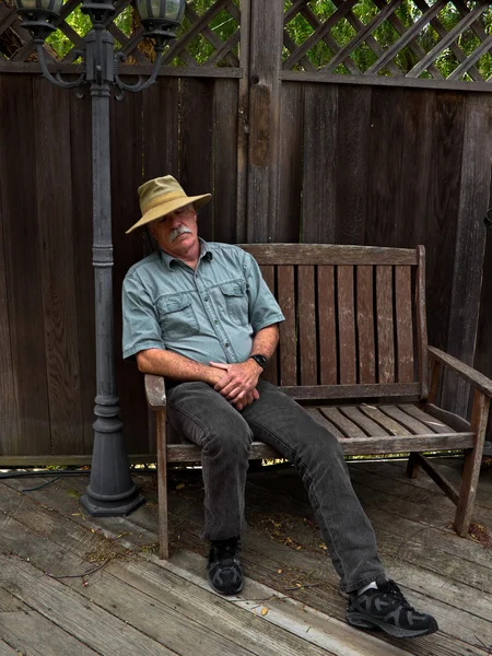 Man in a Hat Napping on a bench Royalty Free Stock Photos