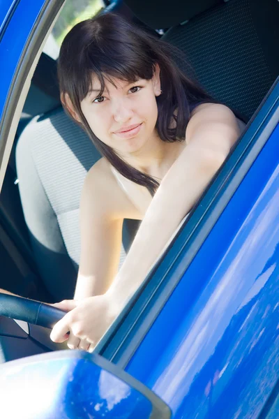 Girl in blue car — Stock Photo, Image