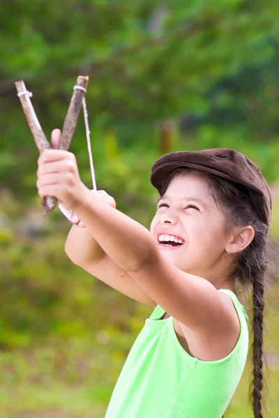 Girl with slingshot — Stock Photo, Image