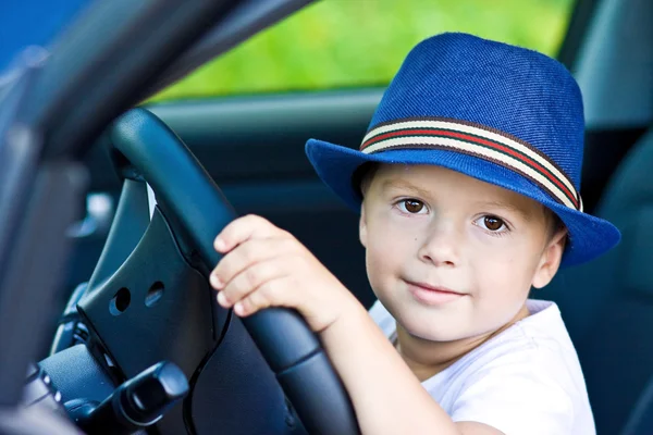 Cute barefoot driver in car — Stock Photo, Image