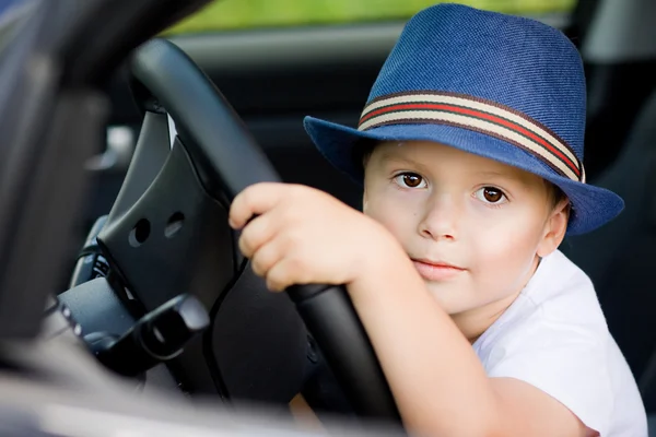 Cute barefoot driver in car — Stock Photo, Image