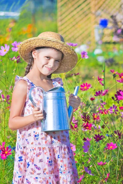 Girl posing with metal watering can shows thumb up — Stock Photo, Image