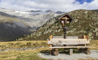 Wayside shrine and bench in the mountains