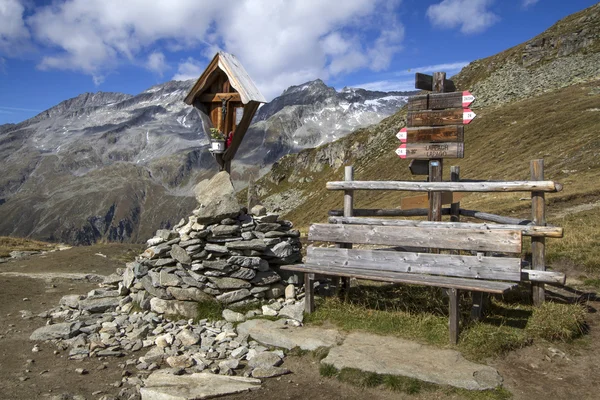 Wayside shrine and bench in the mountains